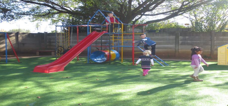 Children on Jungel Gym in play area
